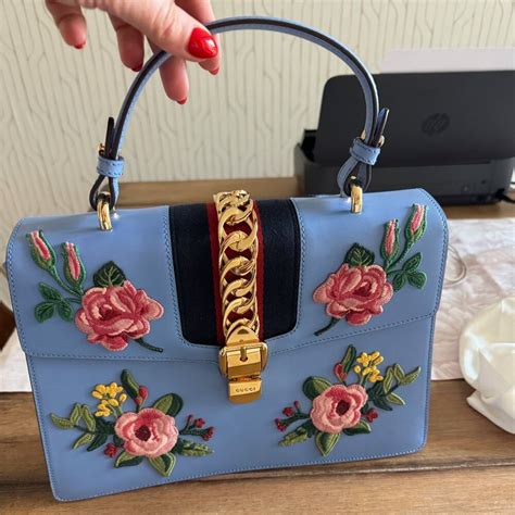 gucci beurs|Gucci floral handbags.